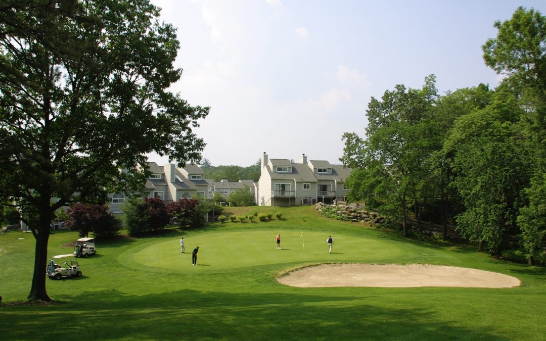 Pocono Mountain Villas with Golfers on the Green in the foreground